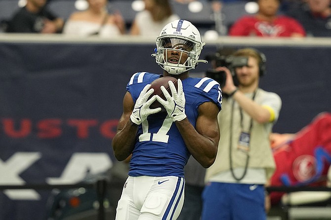 Indianapolis Colts wide receiver Mike Strachan (17) catches a pass before an NFL football game against the Houston Texans Sunday, Sept. 11, 2022, in Houston. (AP Photo/David J. Phillip)