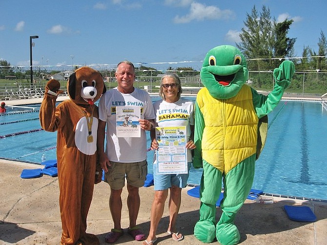 ANDY and Nancy Knowles with Let’s Swim Bahamas mascots Tim and Snorkel.