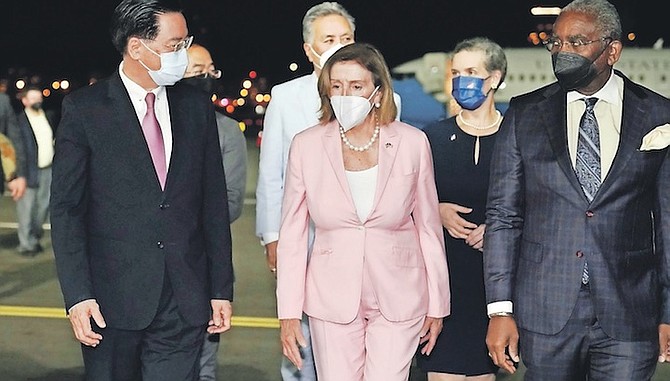 US House Speaker Nancy Pelosi, centre, walks with Taiwan’s Foreign Minister Joseph Wu, left, as she arrives in Taipei, Taiwan, last month. Photo: Taiwan Ministry of Foreign Affairs via AP