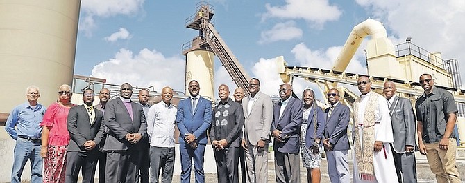 WORKS and Utilities Minister Alfred Sears; Parliamentary Secretary Bacchus Rolle; Minister of State in the Office of the Prime Minister Myles LaRoda; Trevor Newbold, finance officer in the Ministry of Works and Utilities; Ryan Rahming, general manager of BahaMix; Rev Dr Delton Fernander; Rev Laish Boyd, and other BahaMix staff at the asphalt plant ribbon cutting. Photo: Austin Fernander