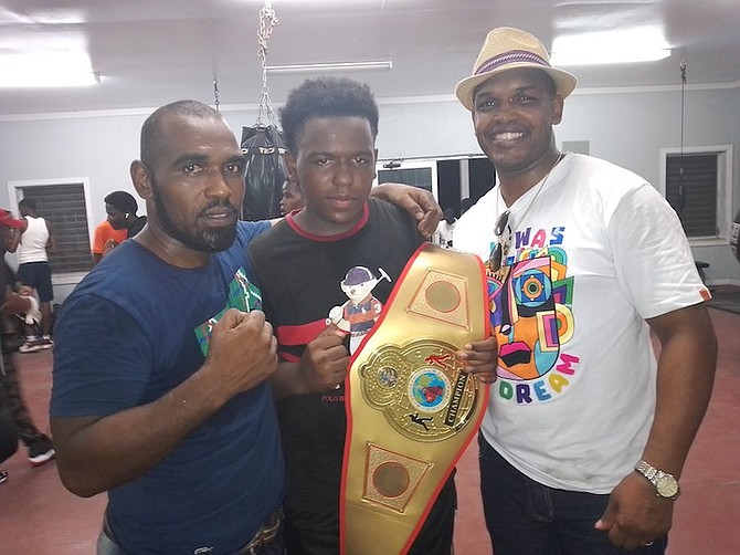 FATHER and son Brandon Johnson Sr and Jr pose with brother and uncle Taureano Johnson.