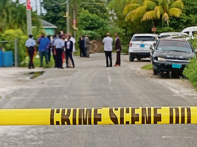 Police at the scene of the shooting yesterday. Photo: Moise Amisial