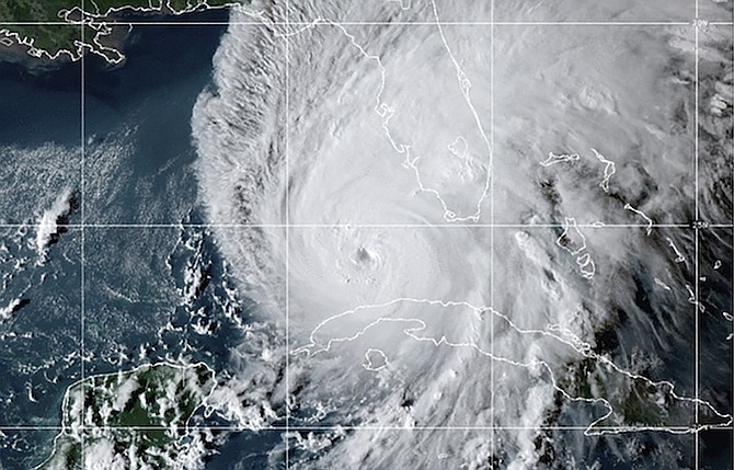 This GOES-East GeoCcolor satellite image taken at 10:10 p.m. EDT on Tuesday, and provided by the National Oceanic and Atmospheric Administration (NOAA), shows Hurricane Ian over the Gulf of Mexico. (NOAA via AP)