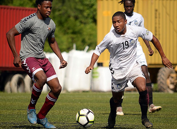 University of The Bahamas midfielder Nathan Wells dribbles the ball past a Bears FC player in their Bahamas Football Association match. (UB Athletics)