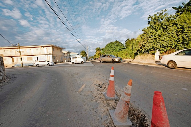 DRIVERS navigating construction work on Village Road. Photo: Moise Amisial