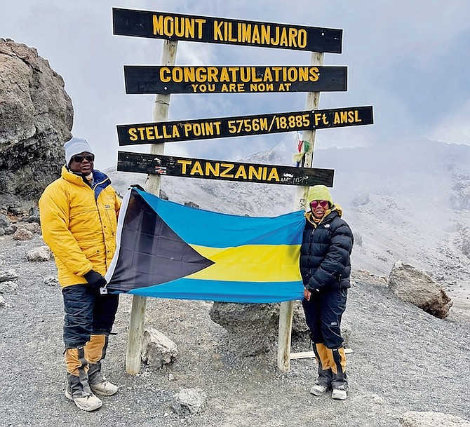 AFTER ten months of training, two Bahamian women, Stacee Bain Crittenden and Dr Nneka Davis, joined by Dr Davis’ husband, Maynard McAlpin, climbed Mount Kilimanjaro, the highest peak in Africa with a group called the Wisdom Walkers. Dr Davis is pictured with her husband flying the Bahamian flag on reaching their goal.
