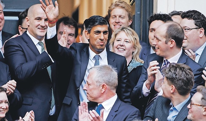 RISHI Sunak waves after winning the Conservative Party leadership contest at the Conservative party Headquarters in London yesterday. He will become the next UK Prime Minister.
Photo: David Cliff/AP