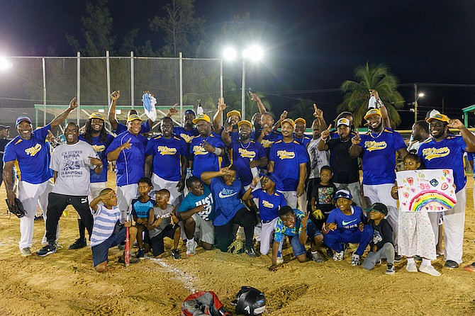 WE ARE THE CHAMPIONS: The C&S Hitmen softball team can be seen after defeating the Cyber Tech Blue Marlins 5-2 in their fifth and deciding game last night to win the New Providence Softball Association’s 2022 men’s championship title in the Bankers Field at the Baillou Hills Sporting Complex. Photo: Austin Fernander/Tribune Staff