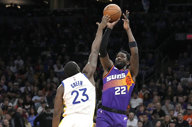Phoenix Suns centre Deandre Ayton (22) during the second half of an NBA basketball game against the Golden State Warriors, Tuesday, in Phoenix. Phoenix won 134-105. (AP Photo/Rick Scuteri)