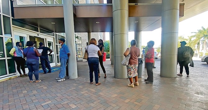 THE QUEUE outside Princess Margaret Hospital yesterday after private pharmacies closed for the day. Photo: Moise Amisial