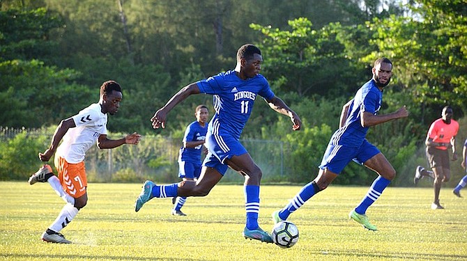 UNIVERSITY of The Bahamas Mingoes men’s soccer team in action against United FC.