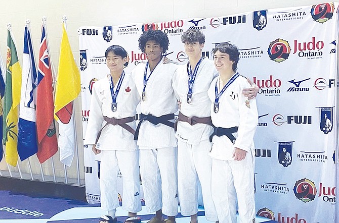 XAVION JOHNSON, second from left, is flanked by his rivals at the Ontario Open Judo Championships at the Toronto Pan Am Sports Center in Ontario.