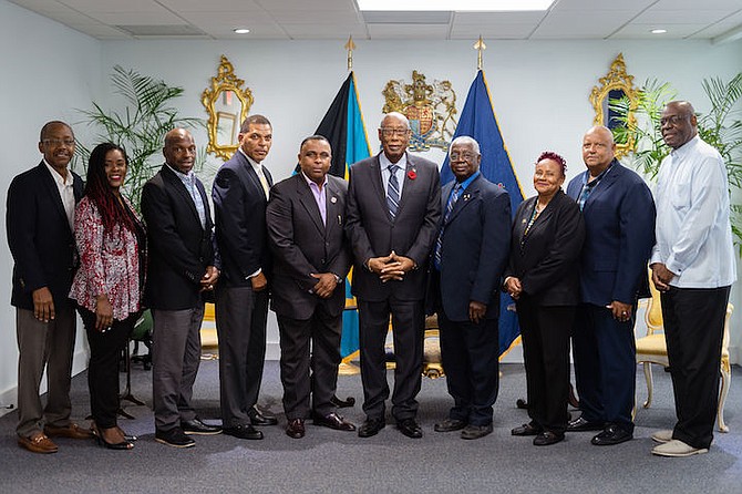 COURTESY CALL - Shown, from left to right, at the Governor General’s Office are Tommy Stubbs, Sandena Neely, Mario Ford, Lyrone Burrows, Theodore Sweeting, Governor General CA Smith, Sam
Rodgers Sr, Jennifer Isaacs, Martin Burrows and Anthony Newbold.