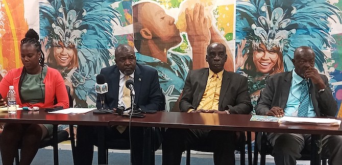 SHOWN, from left to right, are Kelsie Johnson-Sillis, acting director of sports, Minister of Youth, Sports and Culture Mario Bowleg and consultants Rev Harrison Thompson and James “Jimmy” Clarke.
