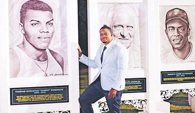 CELEBRITY Artist and culture ambassador Jamaal Rolle with portraits on the Legends Walk of Fame. Photo: Moise Amisial