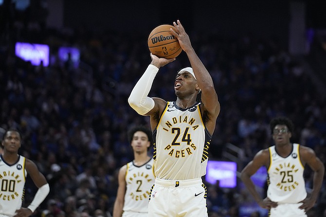 Indiana Pacers forward Buddy Hield (24) shoots a free throw against the Golden State Warriors during the first half of an NBA basketball game in San Francisco, Monday, Dec. 5, 2022. (AP Photo/Godofredo A. Vásquez)