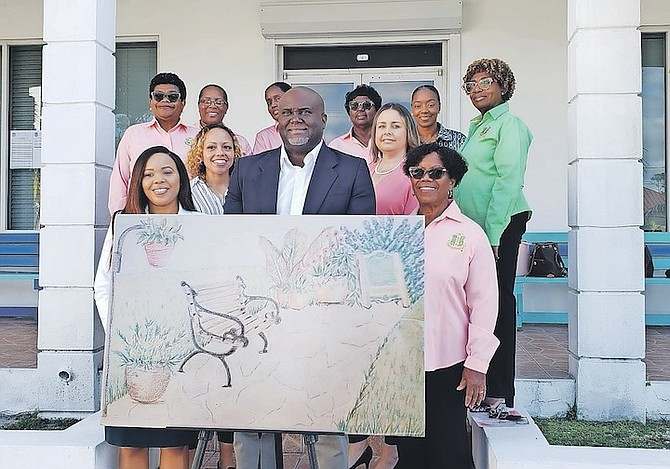 MEMBERS of Alpha Kappa Alpha Sorority Incorporated Pi Upsilon Omega Chapter and UB North’s Dr Ian Strachan at UB with the artist’s design of the bench that will be installed in honor of Dr Keva Bethel at the UB North campus.