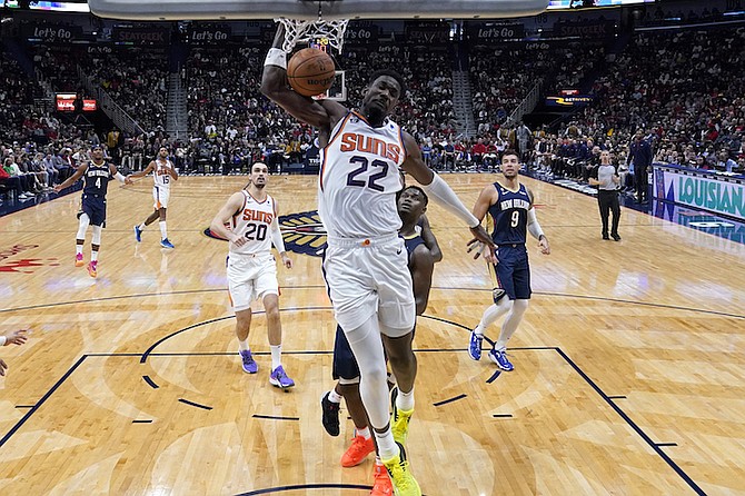 PHOENIX Suns centre Deandre Ayton (22) slam dunks in the second half of an NBA basketball game against the New Orleans Pelicans in New Orleans yesterday. 
(AP Photo/Gerald Herbert)