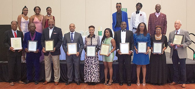 COACHES and sponsors with their plaques on Saturday at the Roadrunners Track Club’s 22nd annual presentations and awards banquet for their athletes.