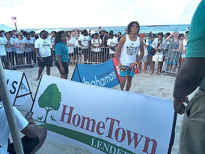 FUN TIME: Players from UAB and Miami get ready to participate in a dance off on the beach at the Atlantis resort.