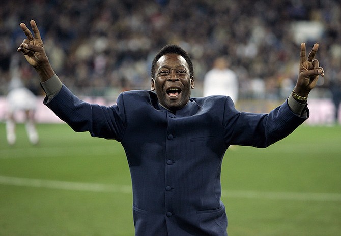 BRAZIL’s soccer legend Pele greets the crowd ahead of a Spanish league soccer match, in the Santiago Bernabeu stadium in Madrid, Jan. 16, 2005. Pelé, the Brazilian king of soccer who won a record three World Cups and became one of the most commanding sports figures of the last century, died in Sao Paulo on Thursday, Dec. 29, 2022. He was 82. (AP Photo/Jasper Juinen)