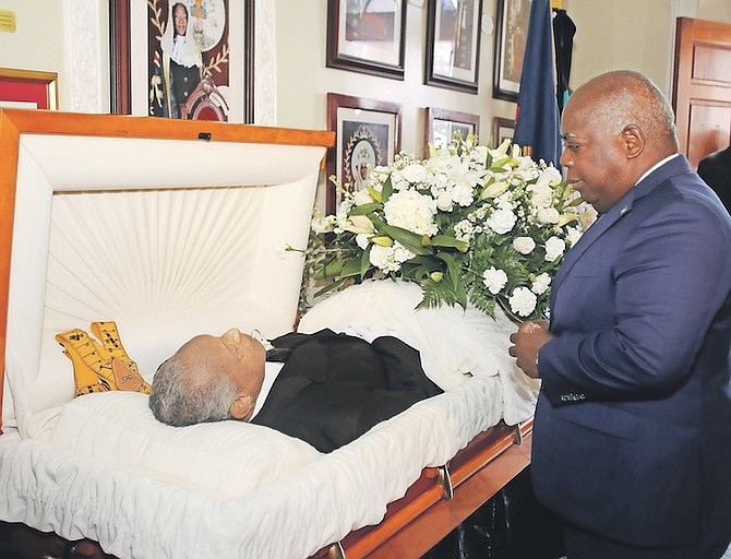 PRIME Minister Philip “Brave” Davis pays his respects to Andrew “Dud” Maynard.
Photos: Patrick Hanna/BIS