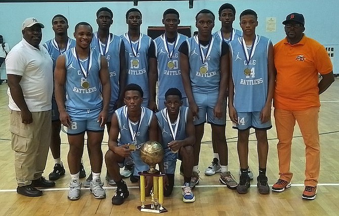 WE ARE THE CHAMPIONS: The CI Gibson Rattlers senior boys with their championship trophy and medals.
