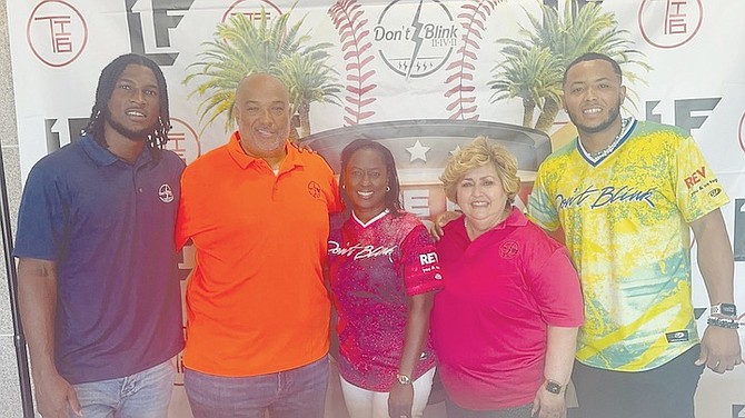 PROFESSIONAL baseball players Lucius Fox, far left, and Todd Isaacs Jr, far right, pose with Todd Isaacs Sr, Dotlee Fox and Gina Gonzalez-Rolle.