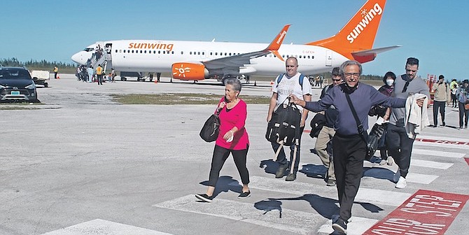CANADIAN passengers arriving in Grand Bahama after the return of Sunwing Airlines. Photos: Vandyke Hepburn