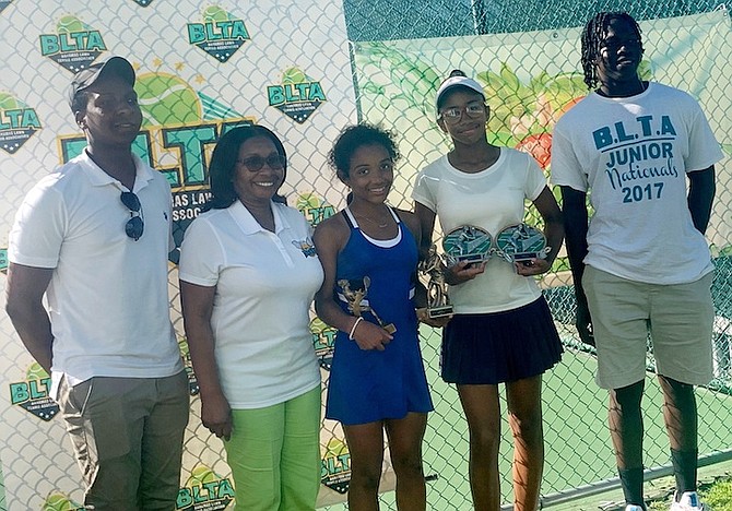 BRIANA Houlgrave and Tatyana Madu receive their champions and runners-up trophies from Chilean Burrows. At left is Andrew Burrows Jr.