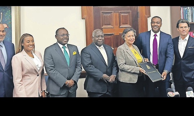 PRIME Minister Philip “Brave” Davis and Deputy Prime Minister Chester Cooper at yesterday’s Heads of Agreement signing.