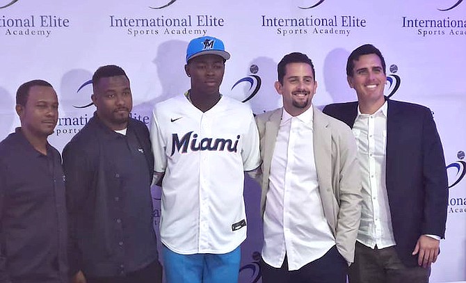 SHOWN, from left to right, are Geron Sands, Albert Cartwright, Janero Miller, Adrian Lorenzo and Adrian Puig at yesterday’s signing.
Photo courtesy of Trevere Saunders