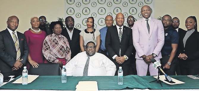 LABOUR Minister Keith Bell and Director of Labour Robert Farquharson with franchisees of the new IHOP chain set to open in the capital at the announcement of job opportunities at the Department of Labour’s next job fair. Photo: Austin Fernander