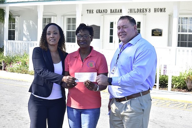 Buckeye Bahamas Hub presented a cheque donation for the Sponsor-a-Child initiative at the Grand Bahama Children's Home on Friday. The executives were also given a tour of the facility. Seen from left are Kim Pratt, assistant manager of government relations at Buckeye Bahamas Hub; June Hutcheson, executive director at the GB Children's Home; and Tom Nash, director of operations at Buckeye Bahamas Hub.