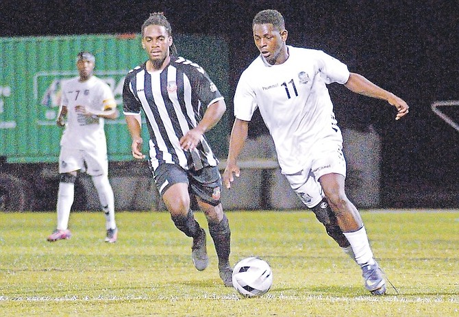 UNIVERSITY of The Bahamas midfielder Ronaldo Green (white 11) dribbles the ball up the field. Green scored three goals as The Mingoes lost 5-4 on penalty kicks. 
(UB ATHLETICS)