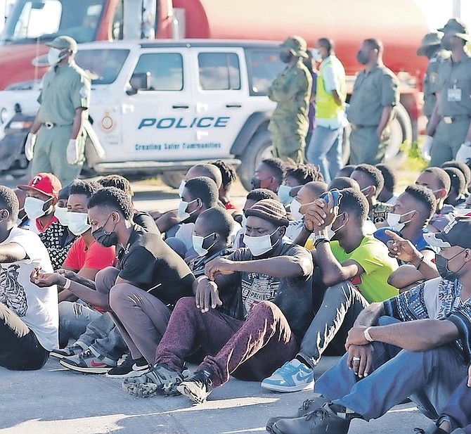 CAPTURED immigrants awaiting a Bahamas Air flight in Inagua to transport them back to their home
country in 2019.