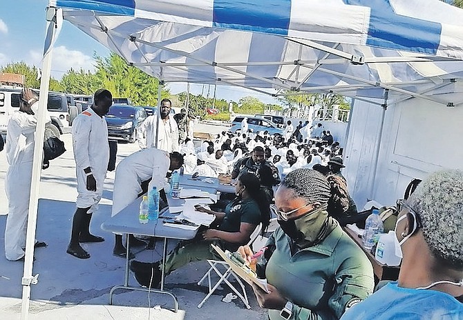 MIGRANTS being examined by a medical team in Inagua.
Photo: Ministry of Health and Wellness