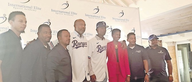 SEBASTIAN Walcott is shown with his parents and coaches from the I-Elite Baseball Academy.