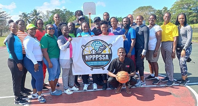 NPPPSSA coaches and instructor Christian Wilmore, bending down, pose for a group shot.