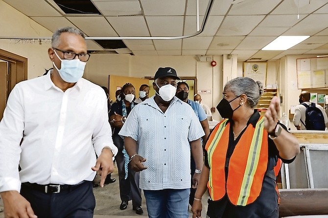 Prime Minister Philip ‘Brave’ Davis tours Princess Margaret Hospital with chief hospital administrator Mary Walker and Minister of Health and Wellness Michael Darville to view conditions and the status of renovations on Saturday.
Photo: Austin Fernander