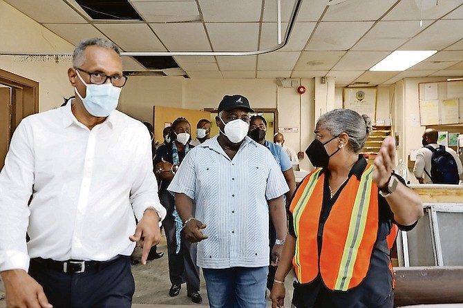 Prime Minister Philip ‘Brave’ Davis tours Princess Margaret Hospital with chief hospital administrator Mary Walker and Minister of Health and Wellness Michael Darville to view conditions and the status of renovations on Saturday.
Photo: Austin Fernander