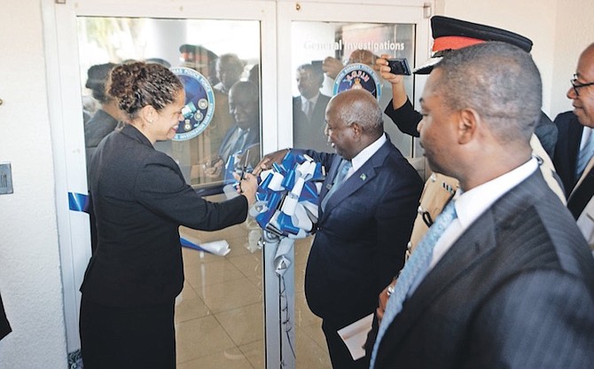 PRIME Minister Philip “Brave” Davis and US Chargé d’Affairs Usha Pitts cutting the ribbon to mark the opening of the Firearms Anti-Gang Task Force Unit yesterday. Photo: Moise Amisial