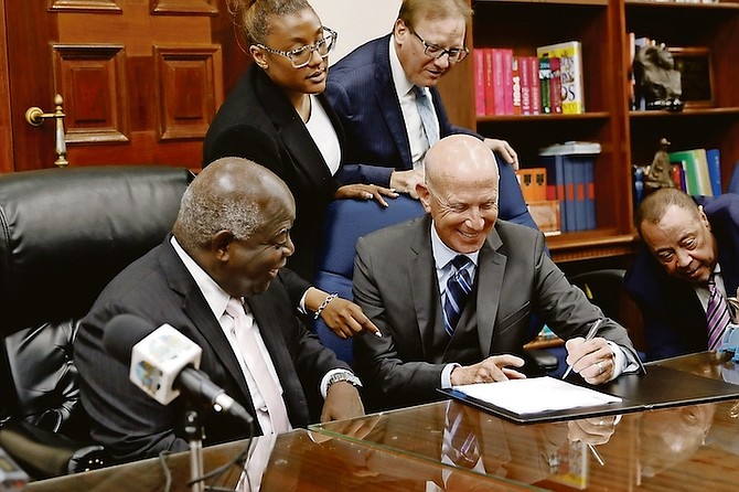 Prime Minister Philip “Brave” Davis and Michael Wiener, of 4M Harbour Island Ltd, at yesterday’s signing. 
Photo: Austin Fernander