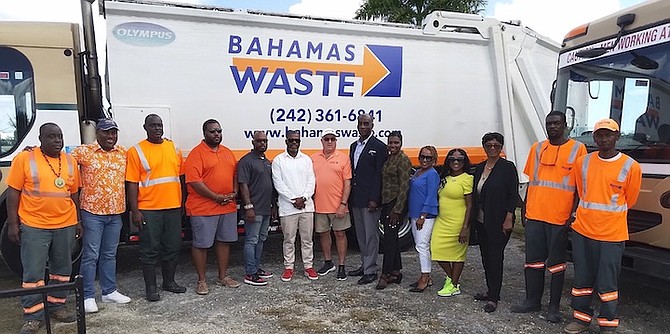 FRANCISCO de Cardenas, the managing director of Bahamas Waste (pink shirt) continues the company’s community giving through a sponsorship and partnership with the local organising committee for the 2023 Golden Jubilee Carifta Games. His company will be responsible for collection of trash at the events.