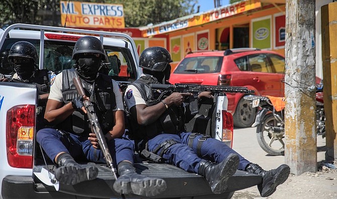 POLICE patrol Port-au-Prince, Haiti, on January 31, after the funeral for three officers who were killed in the line of duty. The officers were killed in an ambush by gang members in the capital on January 20. 
Photo: Odelyn Joseph/AP
