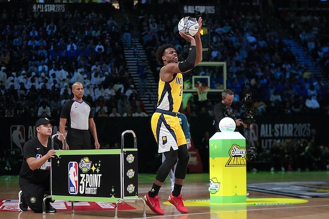 BUDDY HIELD, of the Indiana Pacers, shoots during the three-point contest of the NBA basketball All-Star weekend on Saturday in Salt Lake City. 
(AP Photo/Rick Bowmer)