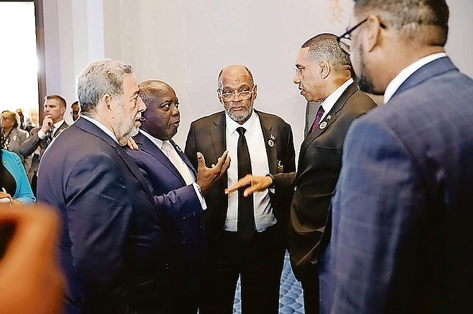 PRIME Minister Phliip “Brave” Davis in discussions during the CARICOM meeting.
Photos: Austin Fernander