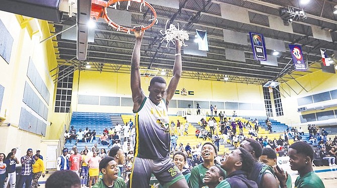 WE ARE THE CHAMPIONS: Most Valuable Player Donell Basden, of the Sunland Baptist Stingers, cuts down the nets after the Stingers stunned the CI Gibson Rattlers 64-52 to capture the 2023 Hugh Campbell Basketball Classic title at the Kendal Isaacs Gymnasium. Photo: Austin Fernander/Tribune Staff