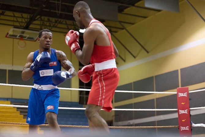 BOXERS square off in Boxing Federation of the Bahamas’ Wellington ‘Sonny Boy’ Rahming and Leonard ‘Boston Blackie’ Miller Memorial Invitational Boxing Championships. 
Photos: Moise Amisial/Tribune Staff