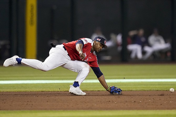 GREAT Britain third baseman BJ Murray Jr is unable to get to a ball hit by Colombia’s Reynaldo Rodríguez, who singled during the eighth inning of a World Baseball Classic game in Phoenix on Monday, March 13, 2023.
(AP Photos/Godofredo A Vásquez)